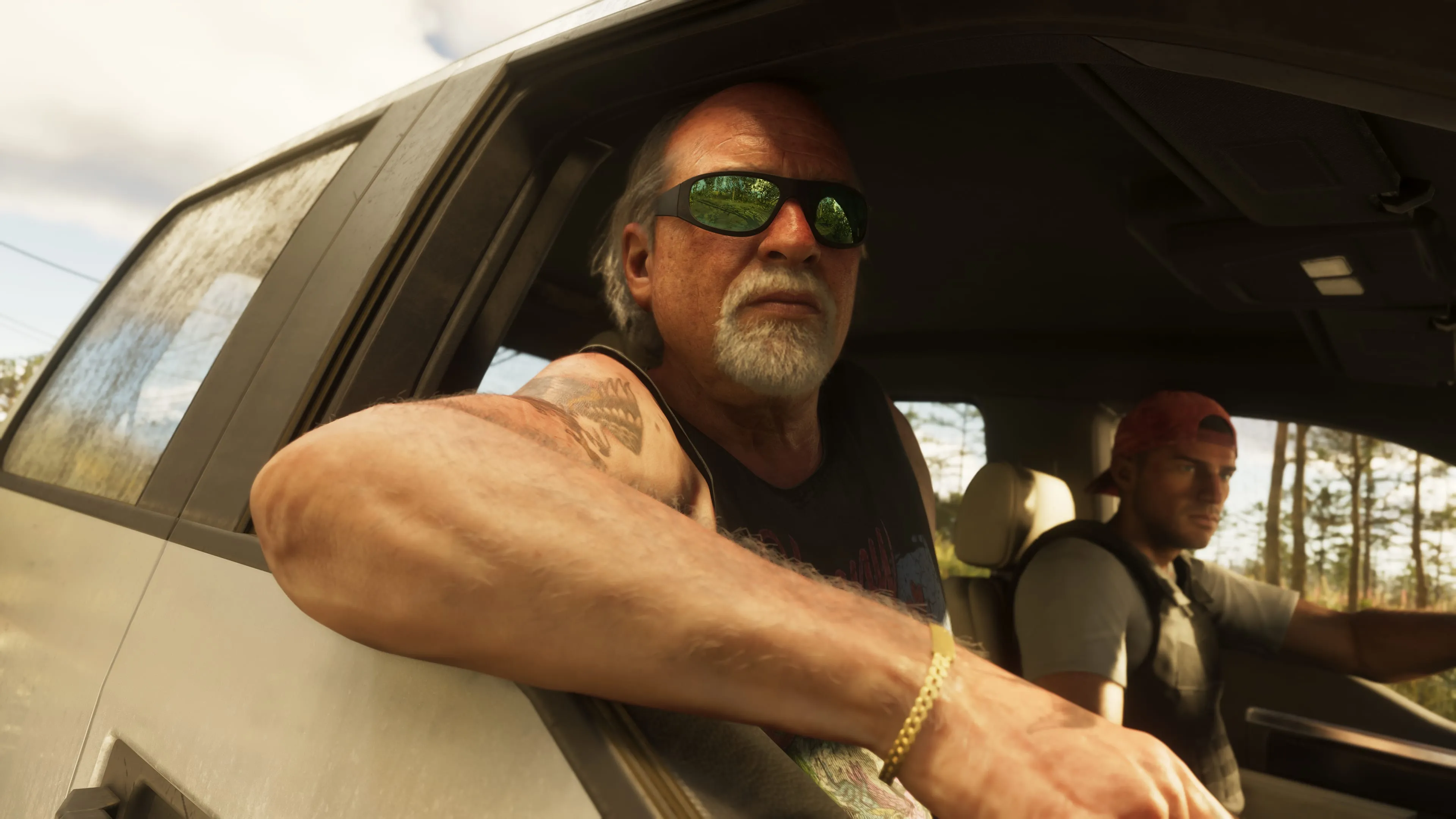 GTA 6 Brian Heder riding shotgun in a truck on a country road