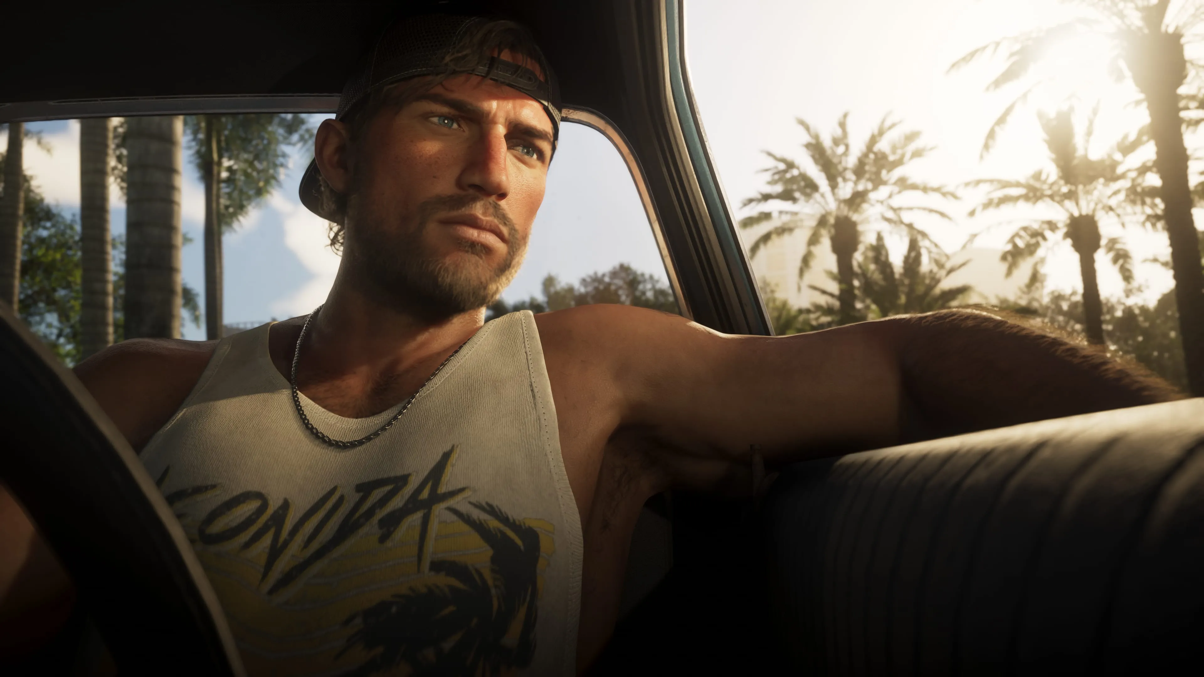 GTA 6 — a man in a backwards cap kicks back in a convertible in Leonida