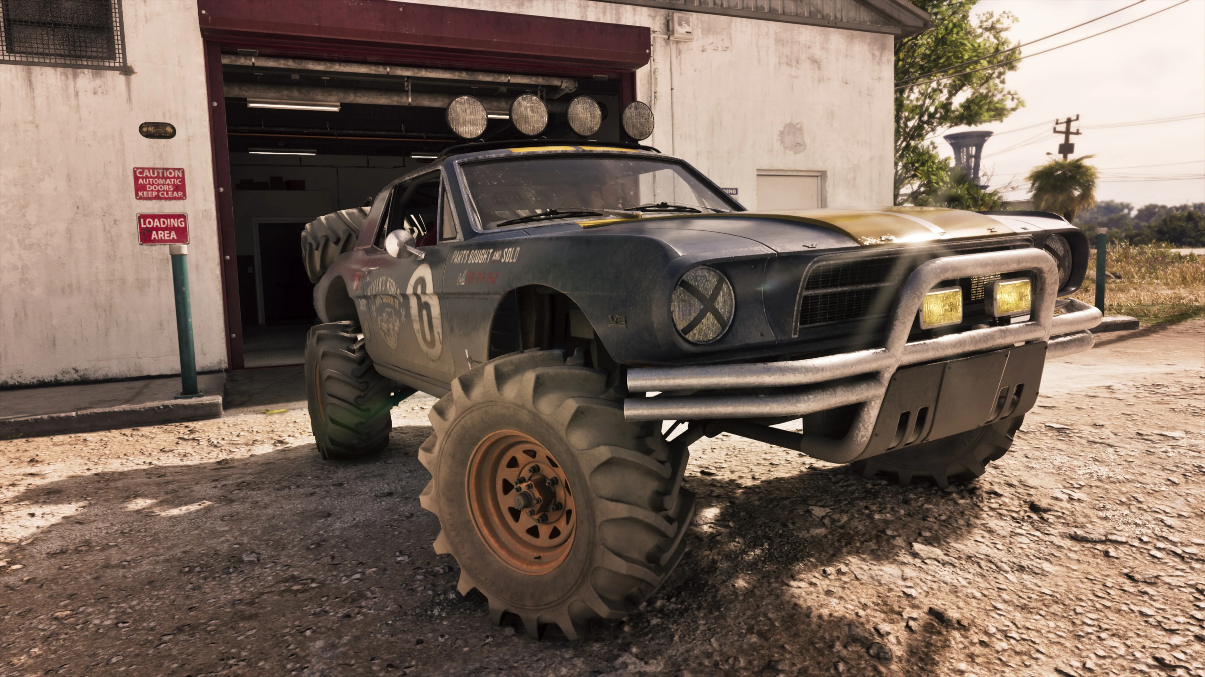 GTA 6 the number 6 Vapid off-road buggy parked on gravel outside an industrial garage